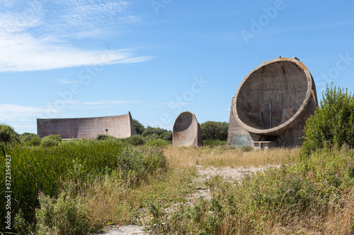 Rare sound mirrors or listening ears. Concrete structures designed to pick up engines of enemy aircraft coming from the channel. Built 1924 on Romney Marsh, UK.