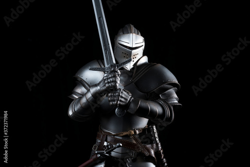 knight with sword blue velvet background
