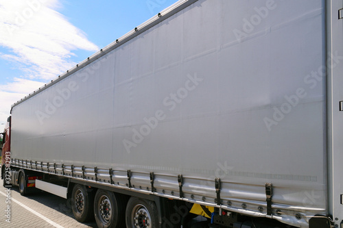 View of the tarpaulin covering the semi-trailer of the truck. Truck transport.