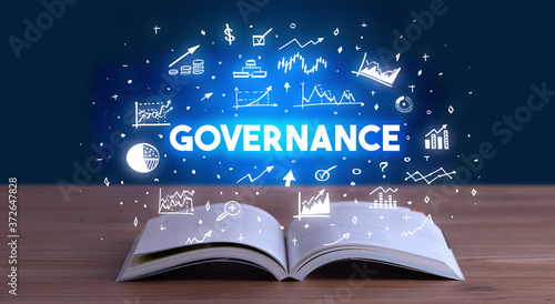 GOVERNANCE inscription coming out from an open book, business concept