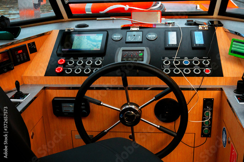 Amsterdam, Netherlands - june 2019. steering wheel and control panel for a pleasure boat
