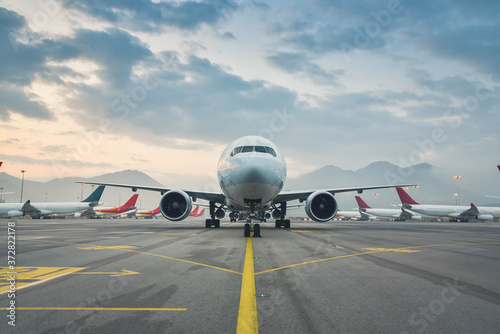 Due to Coronavirus Covid-19 airline fleet parked at the taxiway of Airport 