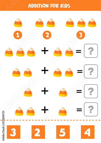 Addition math game with cute cartoon Halloween candy.