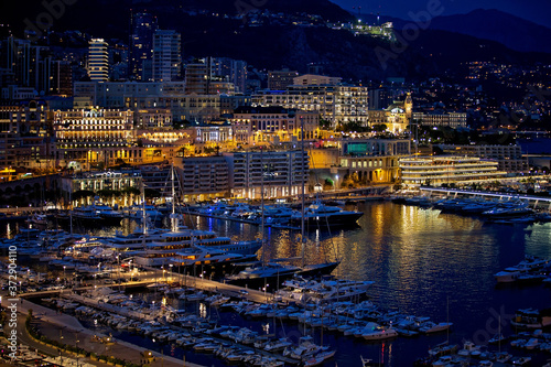 View of the Monaco harbor from the village in the evening