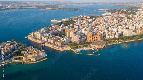 Beautiful panoramic aerial view photo from flying drone on Old medieval Aragonese Castle on sea channel, old town of Taranto city, Puglia (Apulia), Italy (Series)