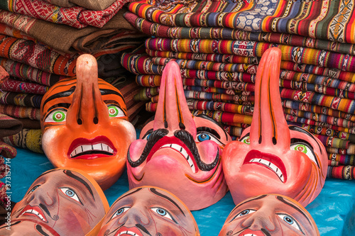 Traditional festival masks, craft market of Pisac, near Cusco, Peru.