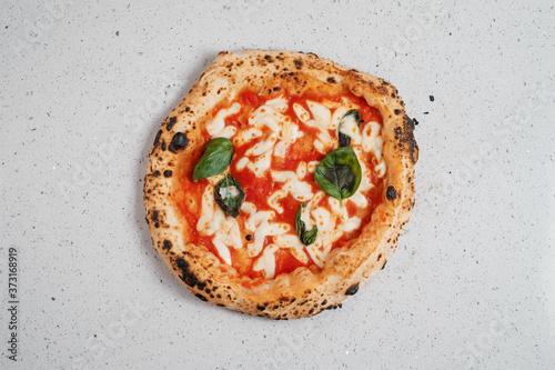 Italian pizza on a white background. Top view.