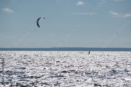 Kitesurfer accelerated in strong wind