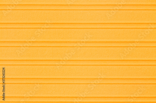 Orange textured cardstock paper closeup background
