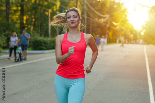 young sport woman is jogging in the park