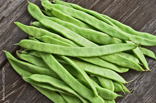 Fresh Roma II Italian Bush Bean or Romano Pole Bean (Phaseolus vulgaris) on wooden background.