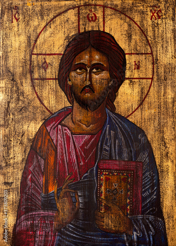 Byzantine or orthodox style icon of Jesus Christ blessing and holding the bible.