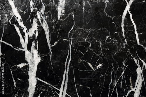 White patterned detailed of black Marquina marble pattern texture for interior, product design. abstract dark background.