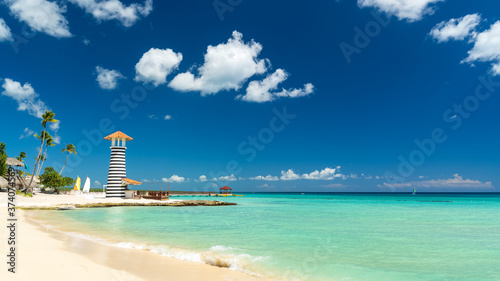 Lighthouse on the beach of the Caribbean, Dominican Republic, Bayahibe - Summer Vacation Concept