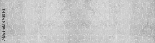 Abstract seamless white grey gray bright concrete cement stone tile wall made of hexagonal geometric hexagon print texture background banner panorama 