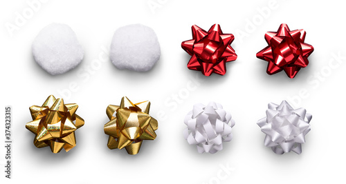 A collection of red, gold and white ribbon bows and gift, present wrapping decorations isolated against a white background.