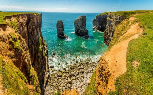 A panorama view of Stack Rocks on the Pembrokeshire coast, Wales near Castlemartin in early summer