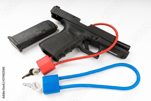 Locked disarmed and secured automatic gun on white background