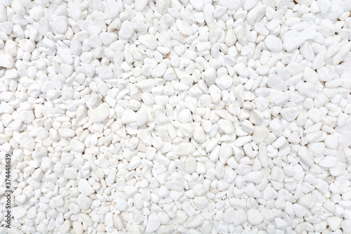 White pebble background texture. Such a stone is used in landscape design.
