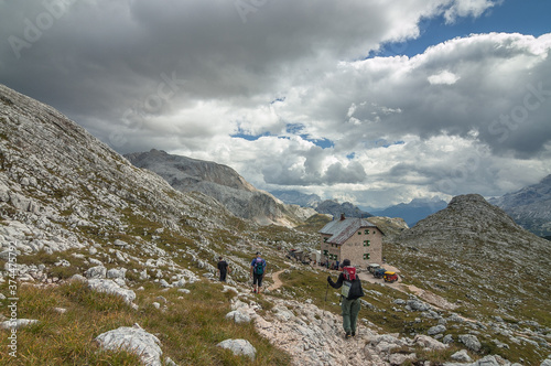 Arriving at Biella refuge from Lago di Braies at the end of Alta Via 1 trek day one, northern Dolomites, Cortina d'Ampezzo municipality, South Tyrol, Italy.