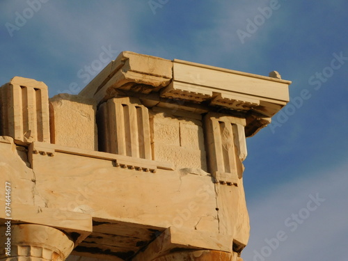 View of an upper corner of the Parthenon, the ancient temple of goddess Athena, in Athens, Greece