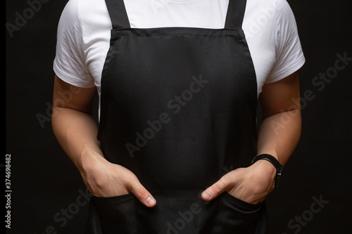 Black apron on a man closeup