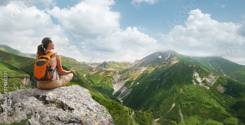 Woman meditating yoga in the mountains sunny Georgia(country). Travel Lifestyle relaxation emotional concept adventure summer vacations.