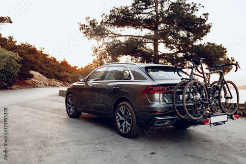 Crossover car with two road bicycles loaded on a rack