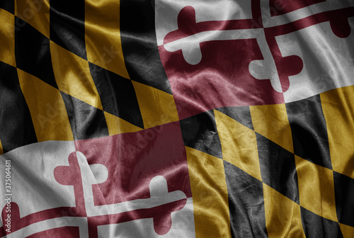 waving shining big flag of maryland state on a silky texture