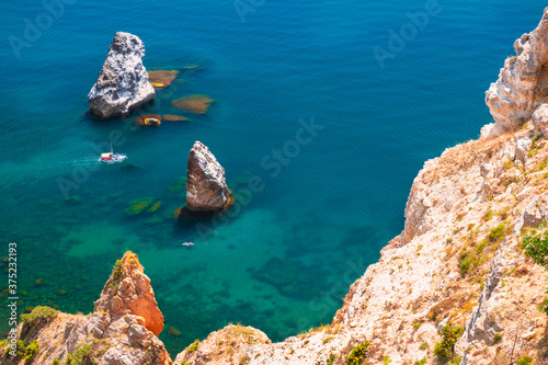 Beautiful sea coast with turquoise water and rocks in Fiolent Cape, Crimea. Summer seascape, famous travel destination