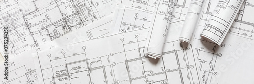 architect design working drawing sketch plans blueprints and making architectural construction model in architect studio,flat lay.