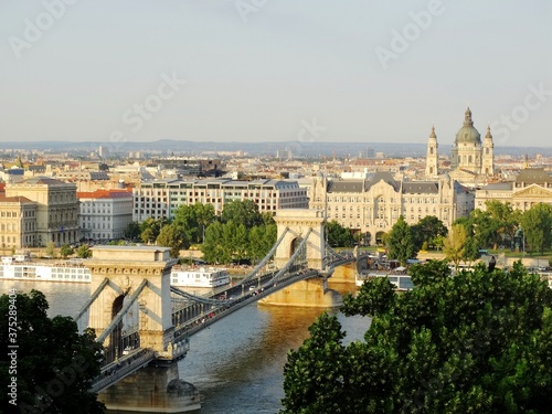 Panoramic view of Szechenyi Chain Bridge in Budapest city in the evening. Szechenyi Chain Bridge is a bridge cross over Danube river and connects Buda and Pest cities.