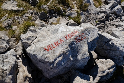 The beautiful Premuziceva Staza mountain path, Velebit National Park, Dinaric Mountains, Croatia. Rock with inscription on Velika Kosa peak.