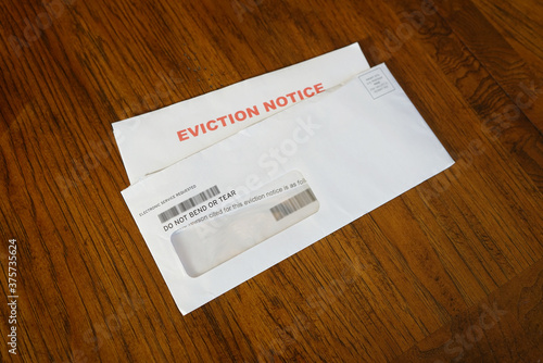 Close-up Of An Eviction Notice In Envelope on Desk