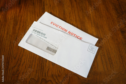 Close-up Of An Eviction Notice In Envelope on Desk