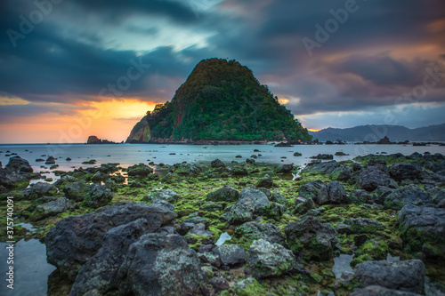 View of Red island beach in Banyuwangi in Indonesia. Java popular travel destination. Summer holiday background.