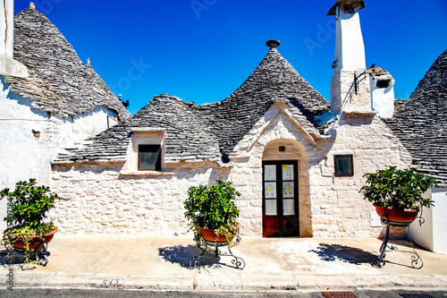 Trulli houses in Alberobello village, Italy. A trullo house is a traditional apulian dry stone hut with a conical roof. Alberobello is part of the UNESCO world heritage site since 1996.
