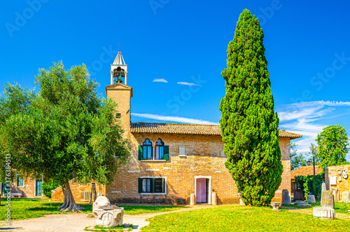 Provincial Museum of Torcello (Museo Provinciale di Torcello) building and Attila Throne ancient stone chair on Torcello island in Venetian Lagoon, Veneto Region, Northern Italy