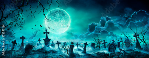 Graveyard At Night - Spooky Cemetery With Moon In Cloudy Sky And Bats 