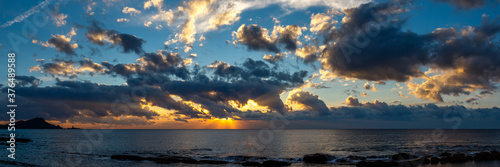 amazing panorama of sunrise or sunset above the seashore and horizon