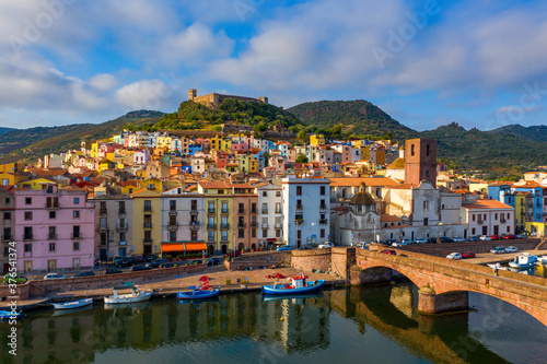 Beautiful view of Bosa town, Sardinia island, Italy. Travel destination. Bosa town with Ponte Vecchio bridge across the Temo river. Marvelous morning view of Sardinia island, Italy, Europe.