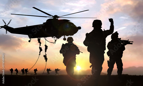 silhouette of military operation at sunset