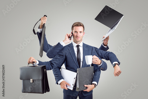 Funny portrait of a businessman with many arms