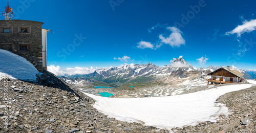 Spectacular mountain panorama with glaciers running towards valley on a sunny day.