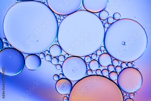 Colorful artistic of oil drop floating on the water. Abstract bubble background.