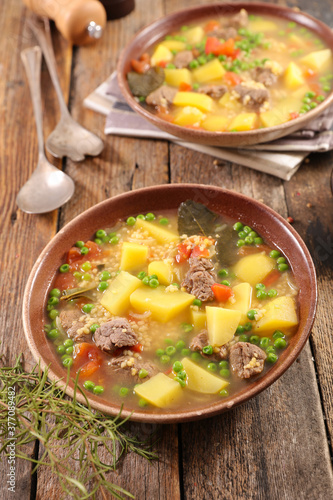 beef soup with potato, pea and carrot
