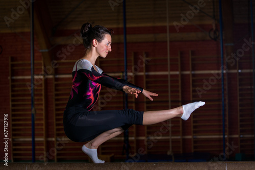 young gymnast on balance beam