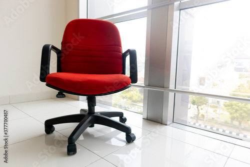 empty red chair in office