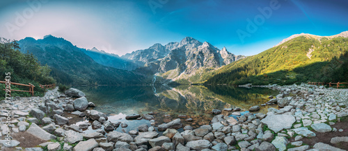 Tatra National Park, Poland. Panorama Famous Mountains Lake Morskie Oko Or Sea Eye Lake In Summer Morning. Five Lakes Valley. Beautiful Scenic Viev