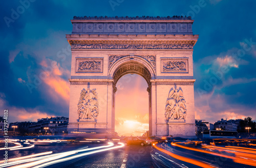 View of famous Arc de Triomphe at sunset